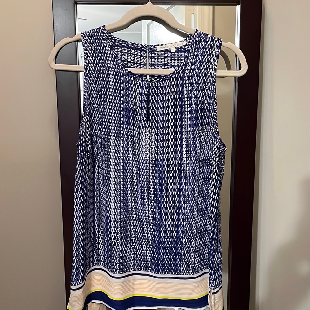 Light weight, polyester, sleeveless tank.